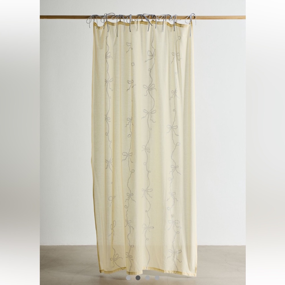 Elegant Cream Sheer Curtain with Bow Design